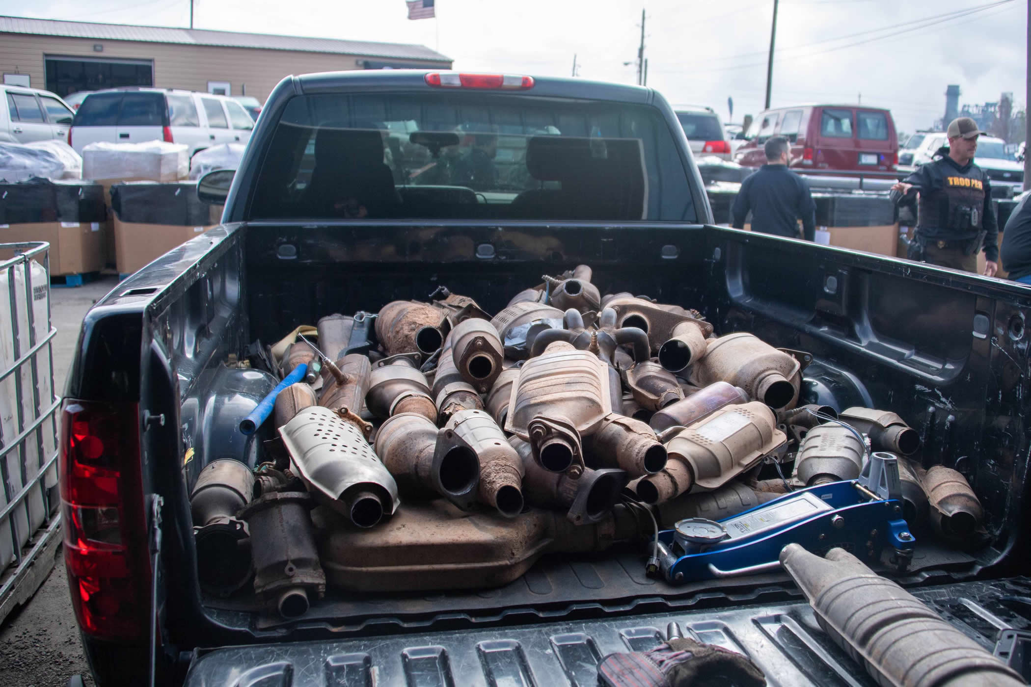 Stolen catalytic converters in the back of a pickup truck bed.