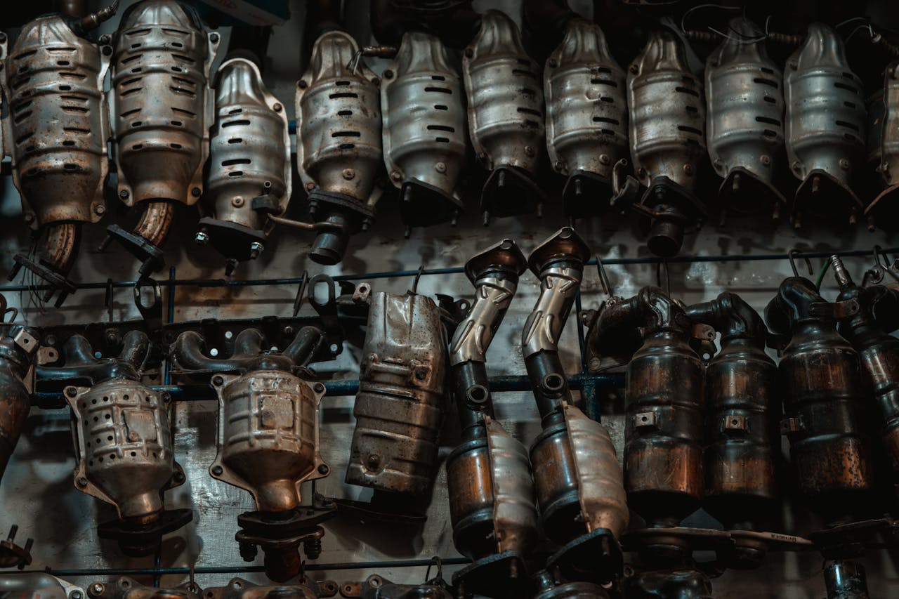 Wall of catalytic converters in a shop.